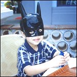 Adi wearing a Batman mask